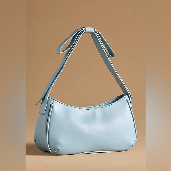 Mali + Lili Handbags - Powder blue shoulder bag with bow detail on strap. Excellent condition with tags